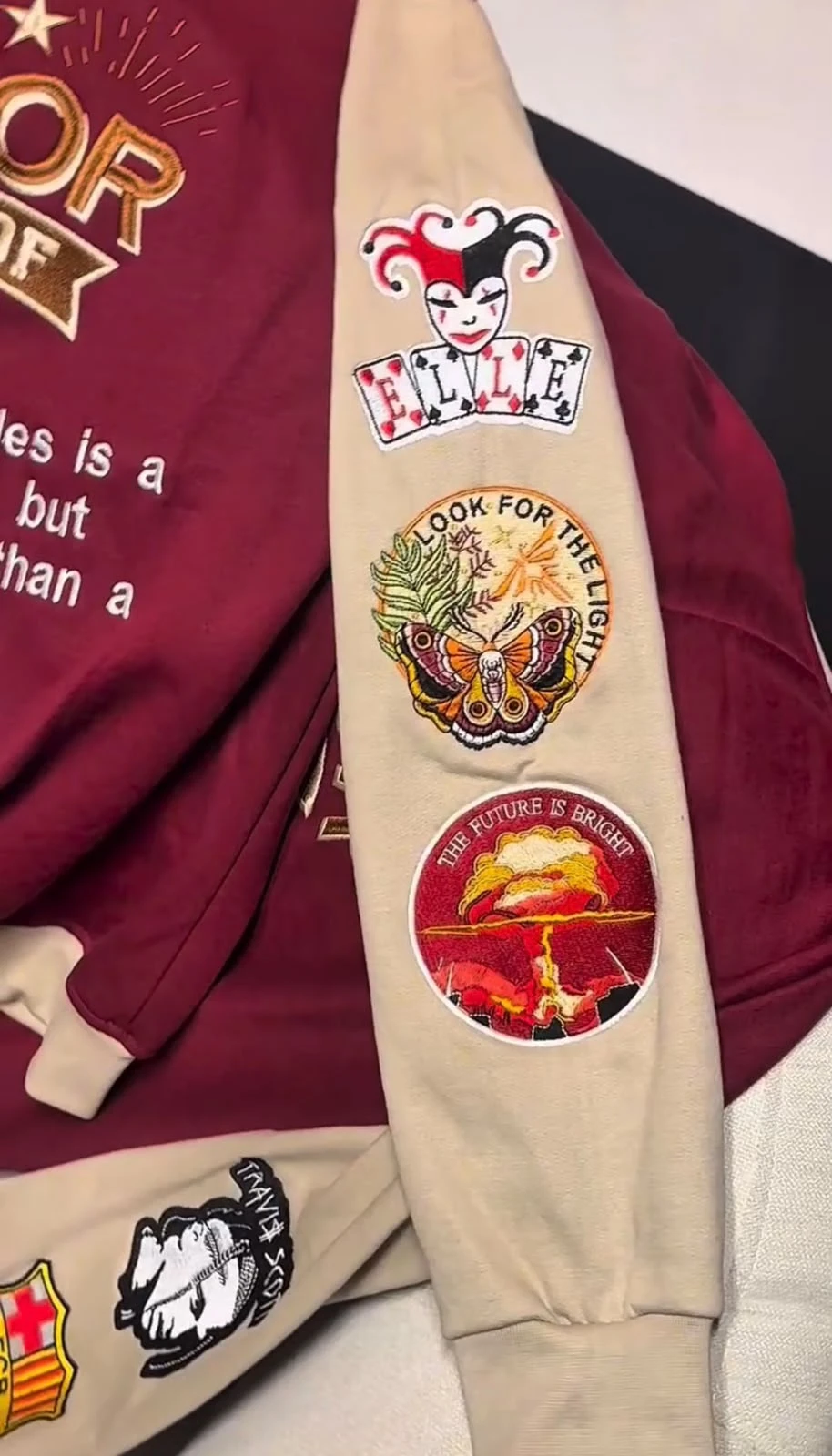 Sleeve with three embroidered patches